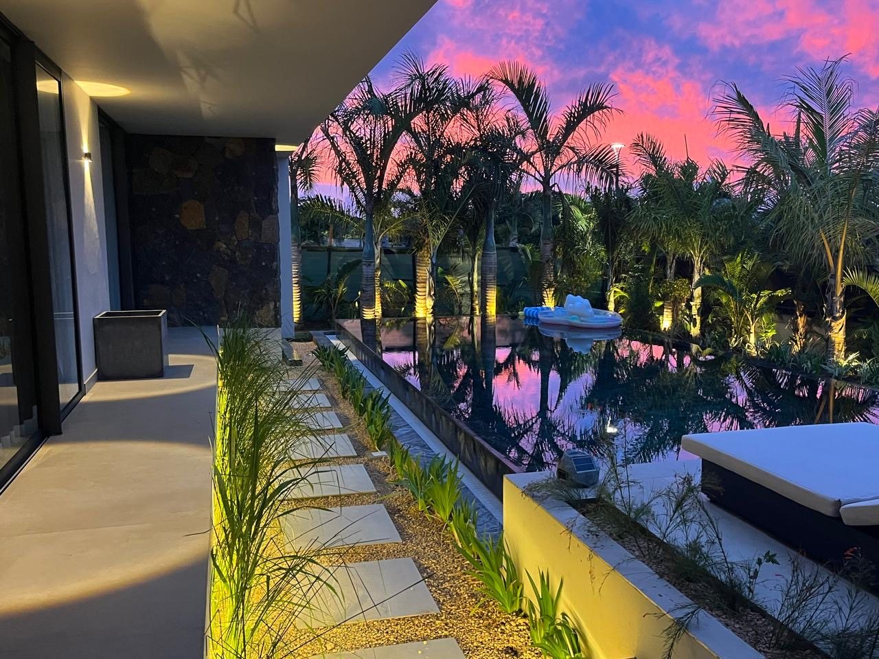 The villa's terrace at dusk